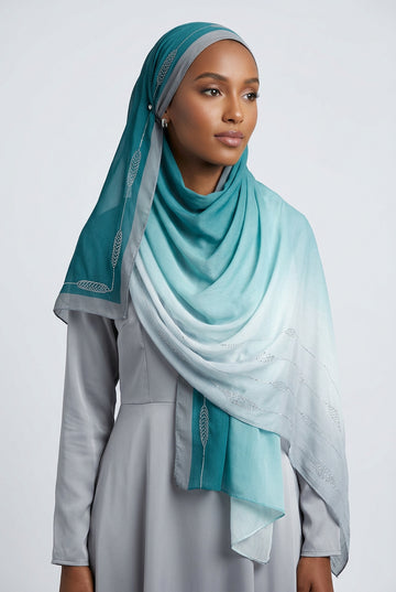 Gradient scarf transitioning from light blue to white on a white background