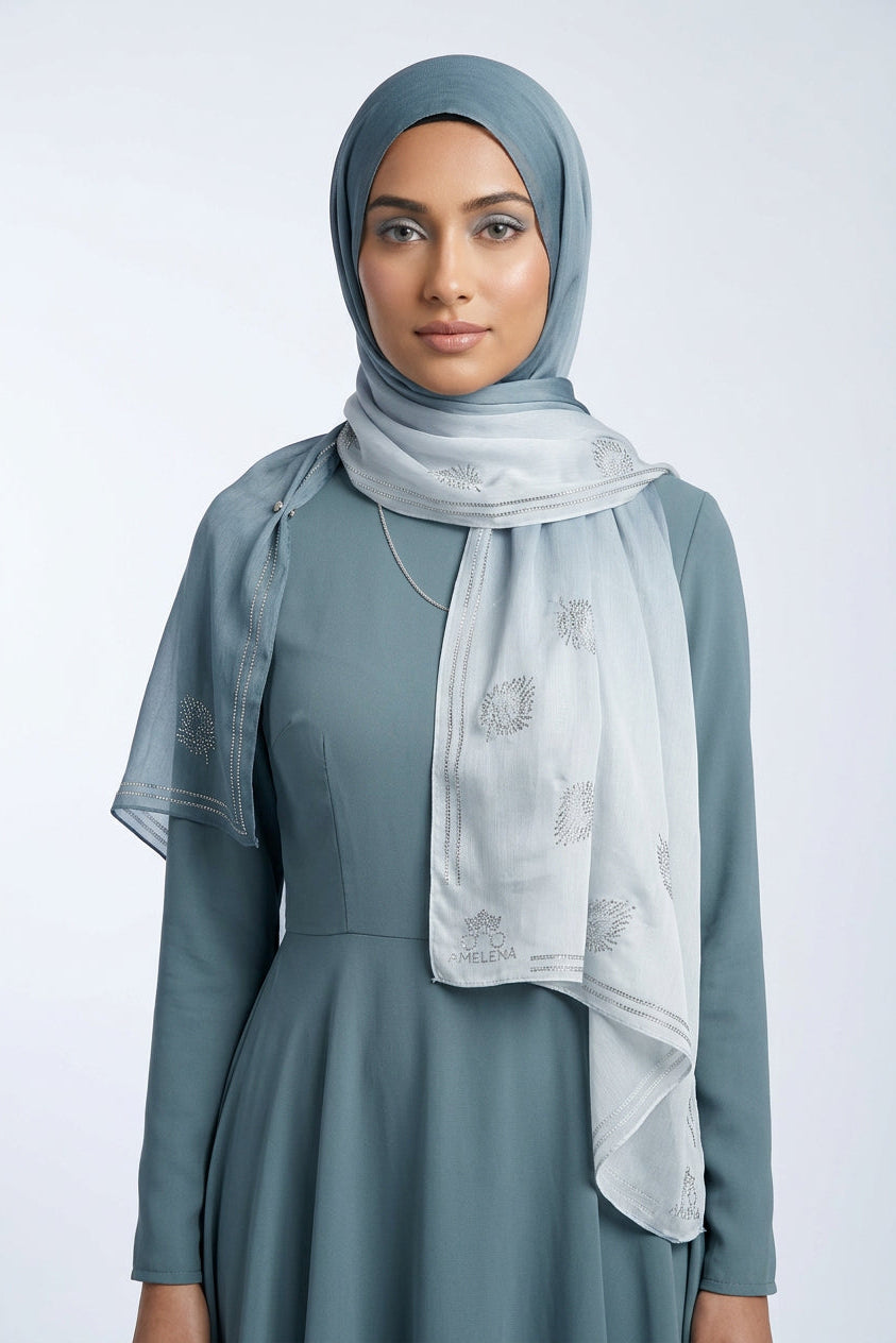 Light blue scarf with floral patterns on a white background