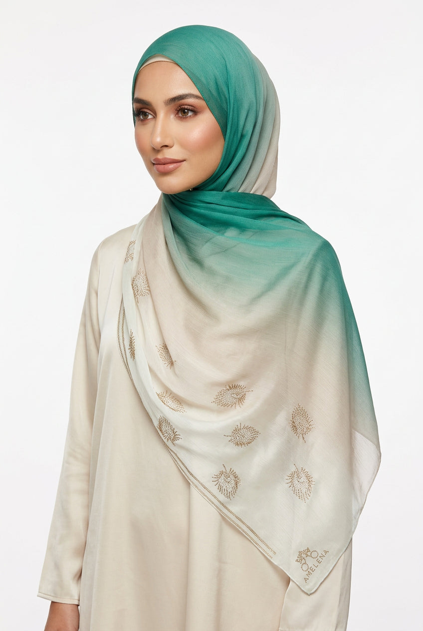 Teal and beige scarf with floral patterns on a white background