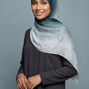 Light blue scarf with floral patterns on a white background