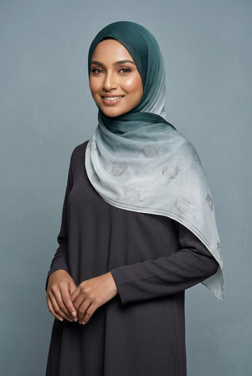 Light blue scarf with floral patterns on a white background