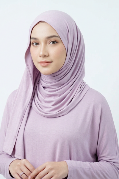 Roll of light purple fabric on a white background