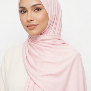 Pink fabric roll on a light pink background