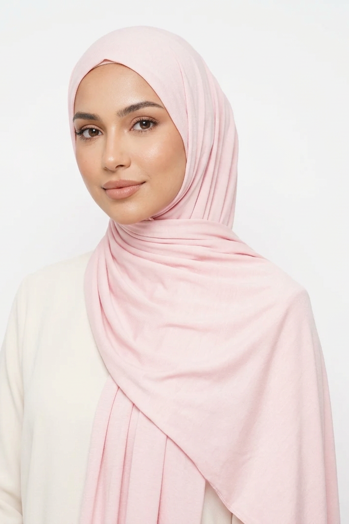 Pink fabric roll on a light pink background