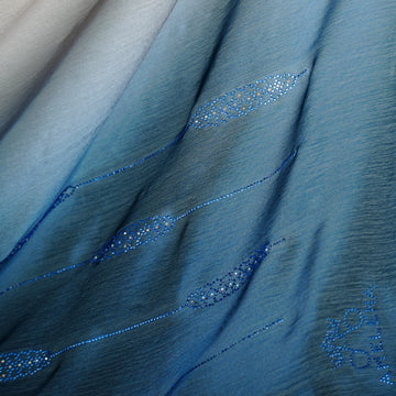 Close-up of blue fabric with decorative stitching
