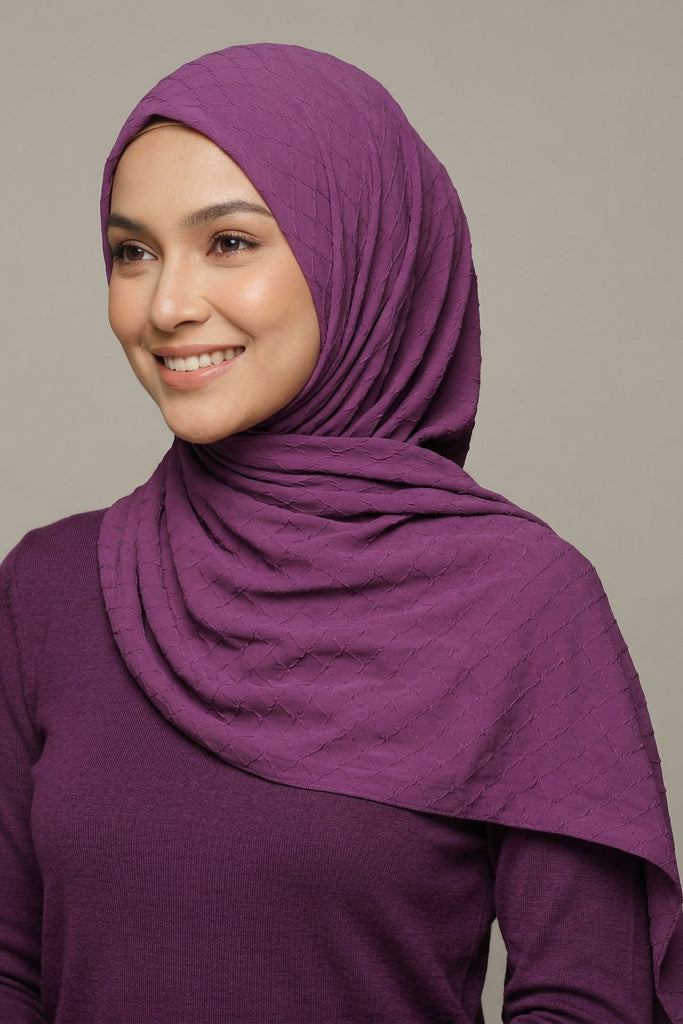 Purple quilted fabric with 'AMELENA' branding.
