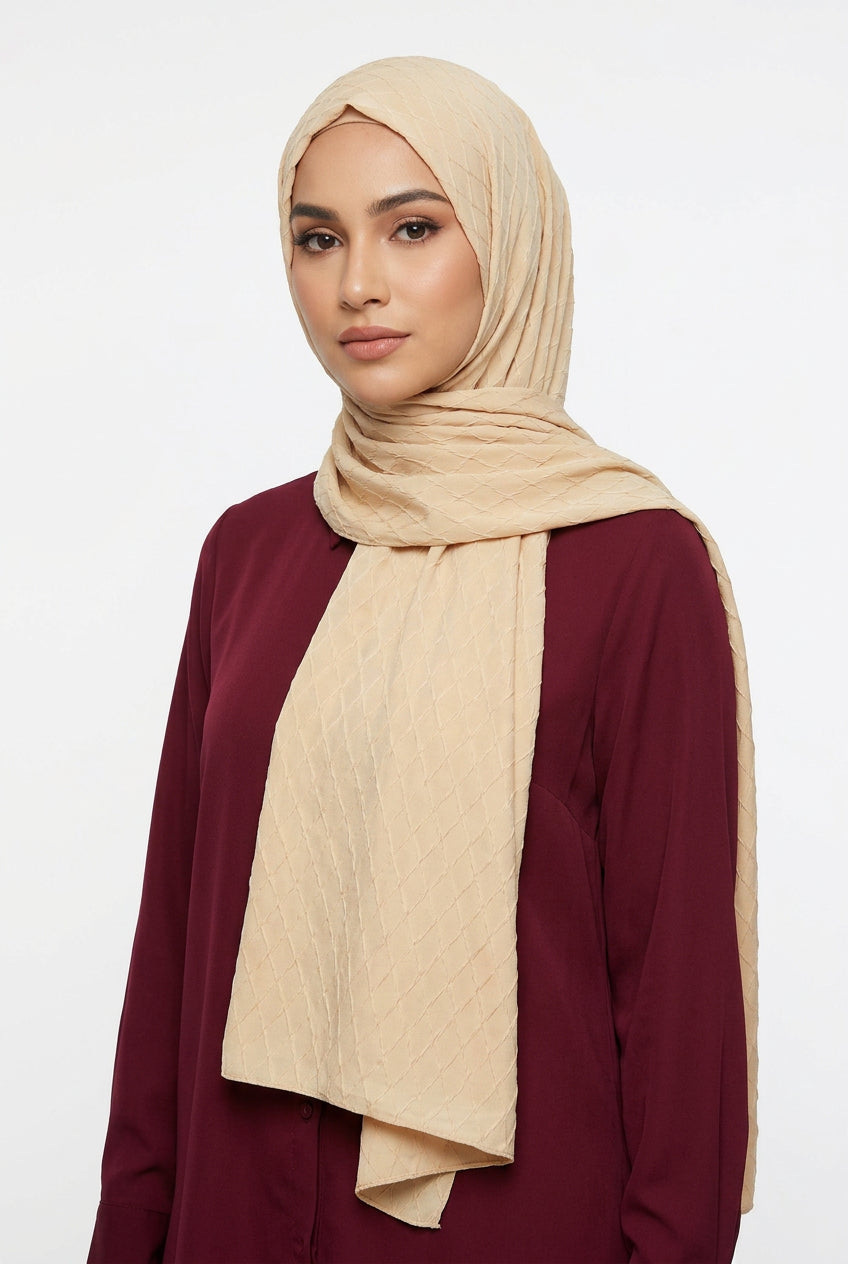 Beige quilted fabric with a swirling pattern
