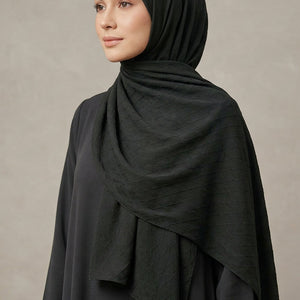 Dark fabric with gold decorative letter 'A' and brand name 'AMELENA'