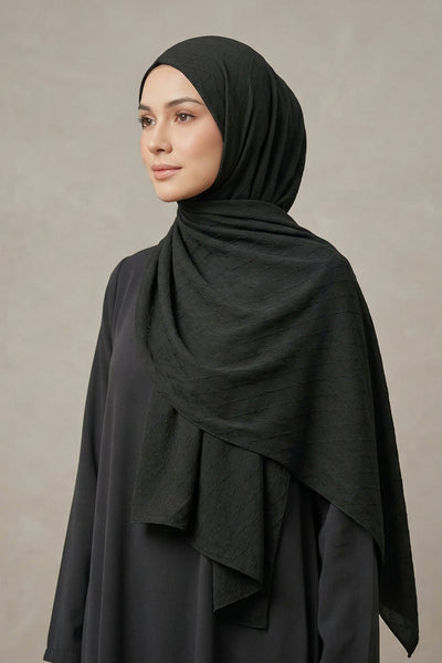 Dark fabric with gold decorative letter 'A' and brand name 'AMELENA'