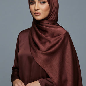 Close-up of brown fabric with 'AMELENA' branding.