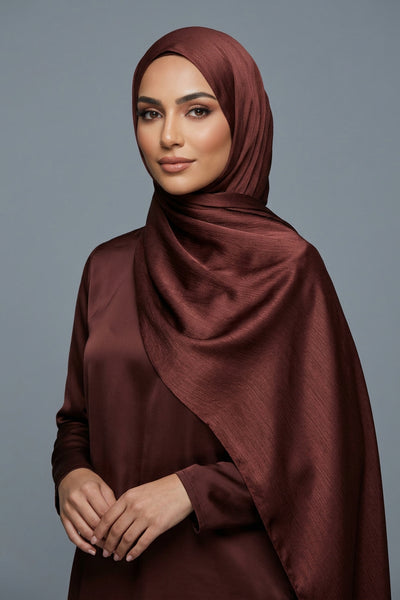 Close-up of brown fabric with 'AMELENA' branding.