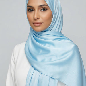 Close-up of light blue fabric with folds