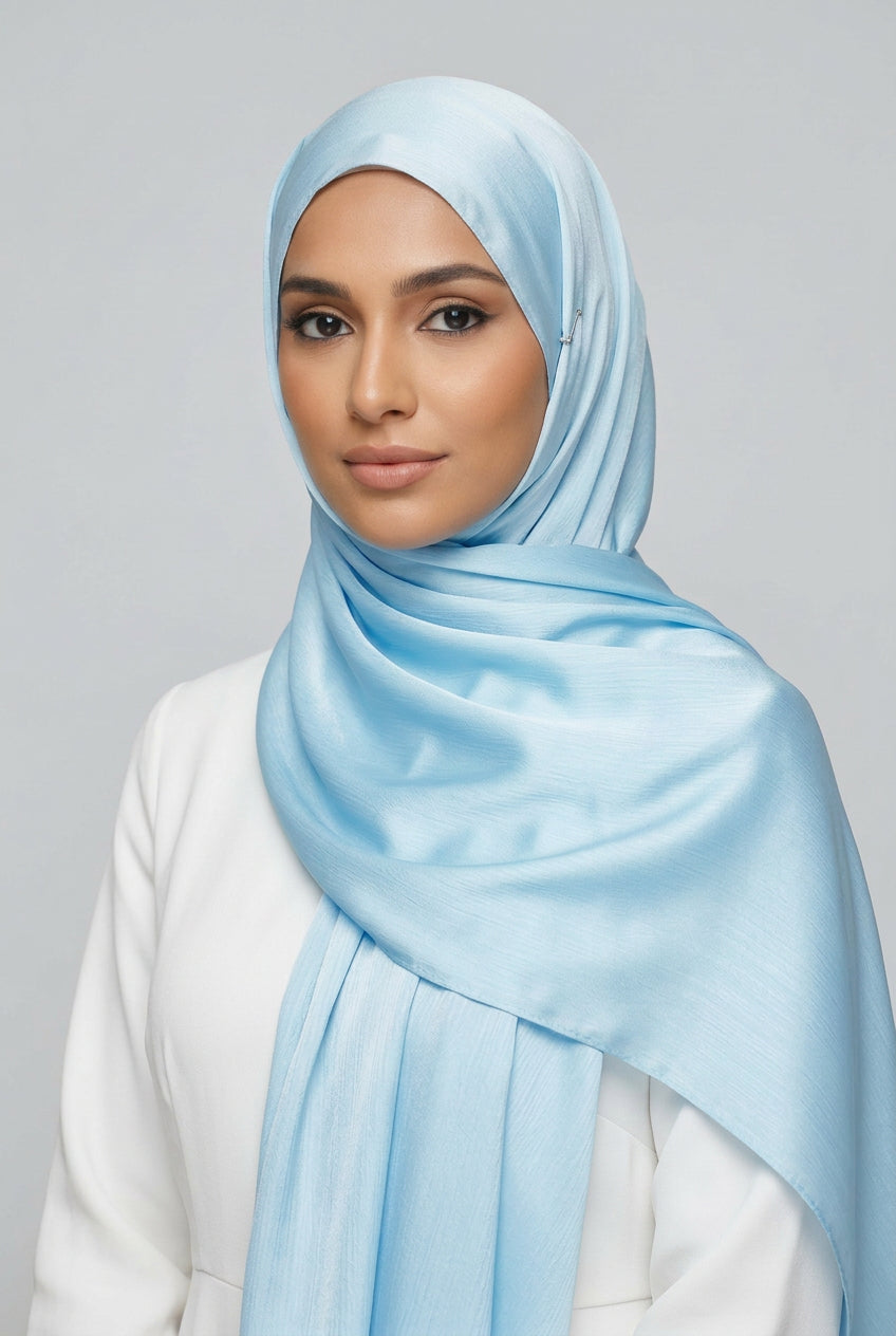 Close-up of light blue fabric with folds