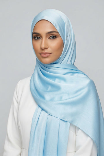 Close-up of light blue fabric with folds