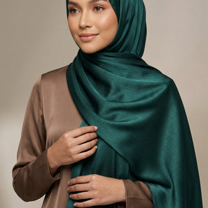 Dark teal fabric with a visible brand logo in the center.