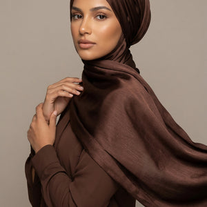Brown fabric with a brand logo in the center