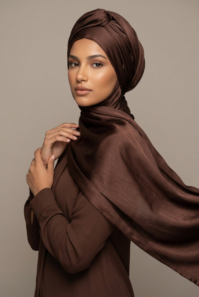 Brown fabric with a brand logo in the center