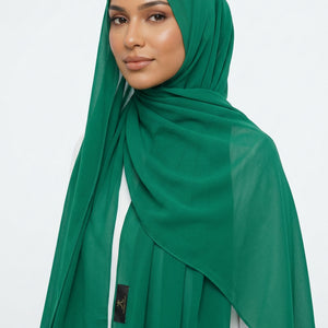 Green scarf on a white background with 'AMELENA' branding.