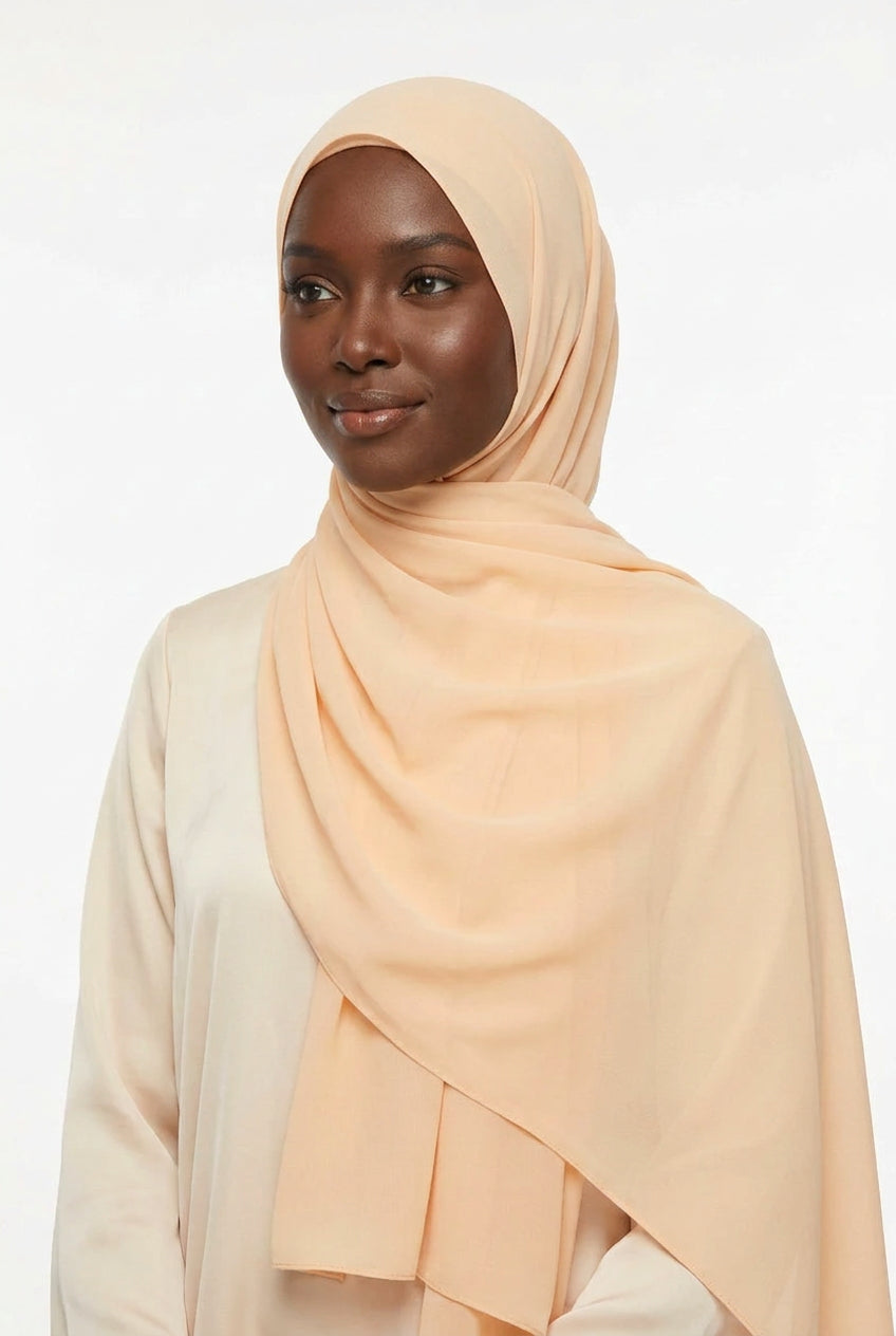 Peach-colored scarf on a light gray background