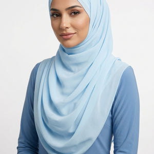 Light blue scarf with a subtle pattern on a white background