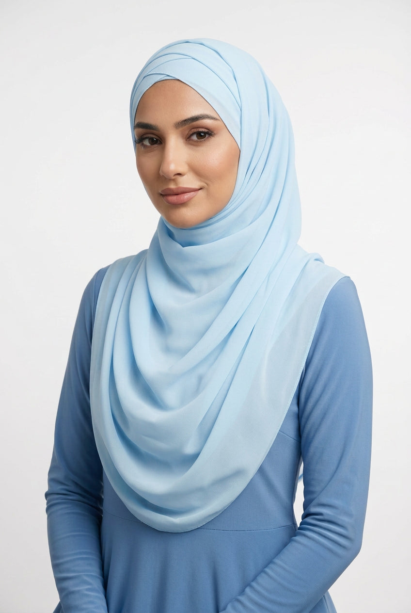 Light blue scarf with a subtle pattern on a white background