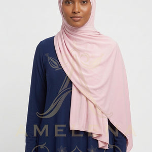 Pink scarf with a subtle pattern on a white background