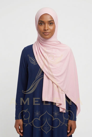 Pink scarf with a subtle pattern on a white background