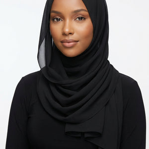 Black scarf on a white background with 'Melen' branding.