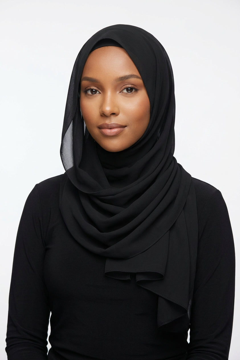 Black scarf on a white background with 'Melen' branding.