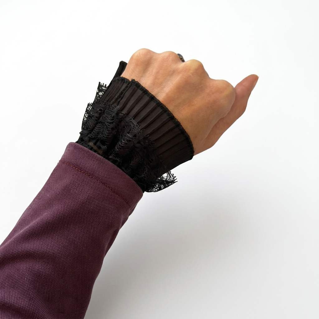 Black lace cuff worn, first view