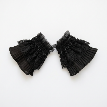 Black lace cuff worn with plum sleeve