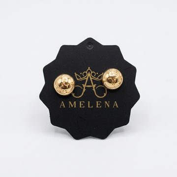 Gold magnetic pins on a clean white background