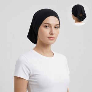 Model wearing black open back bonnet, generating