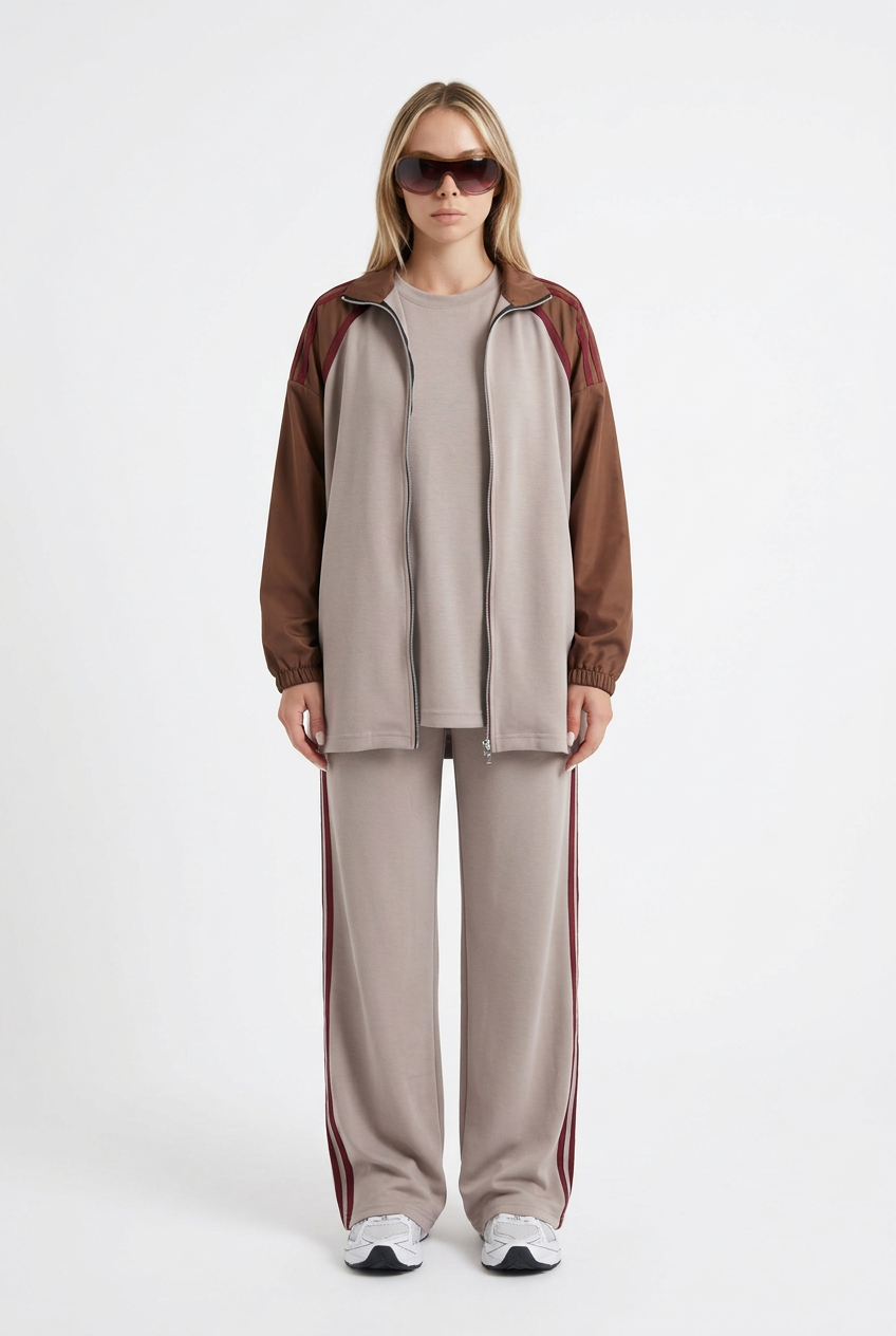 Model wearing the complete taupe outfit on a white background