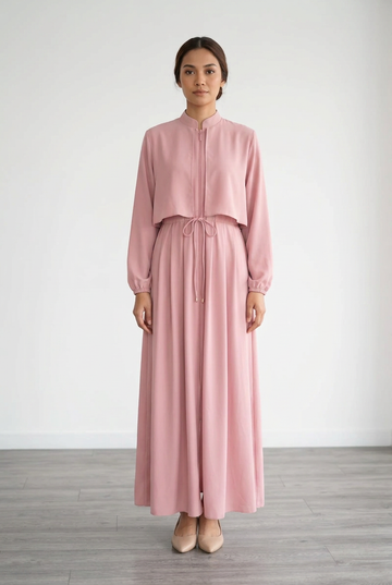 Model wearing the dusty-pink dress