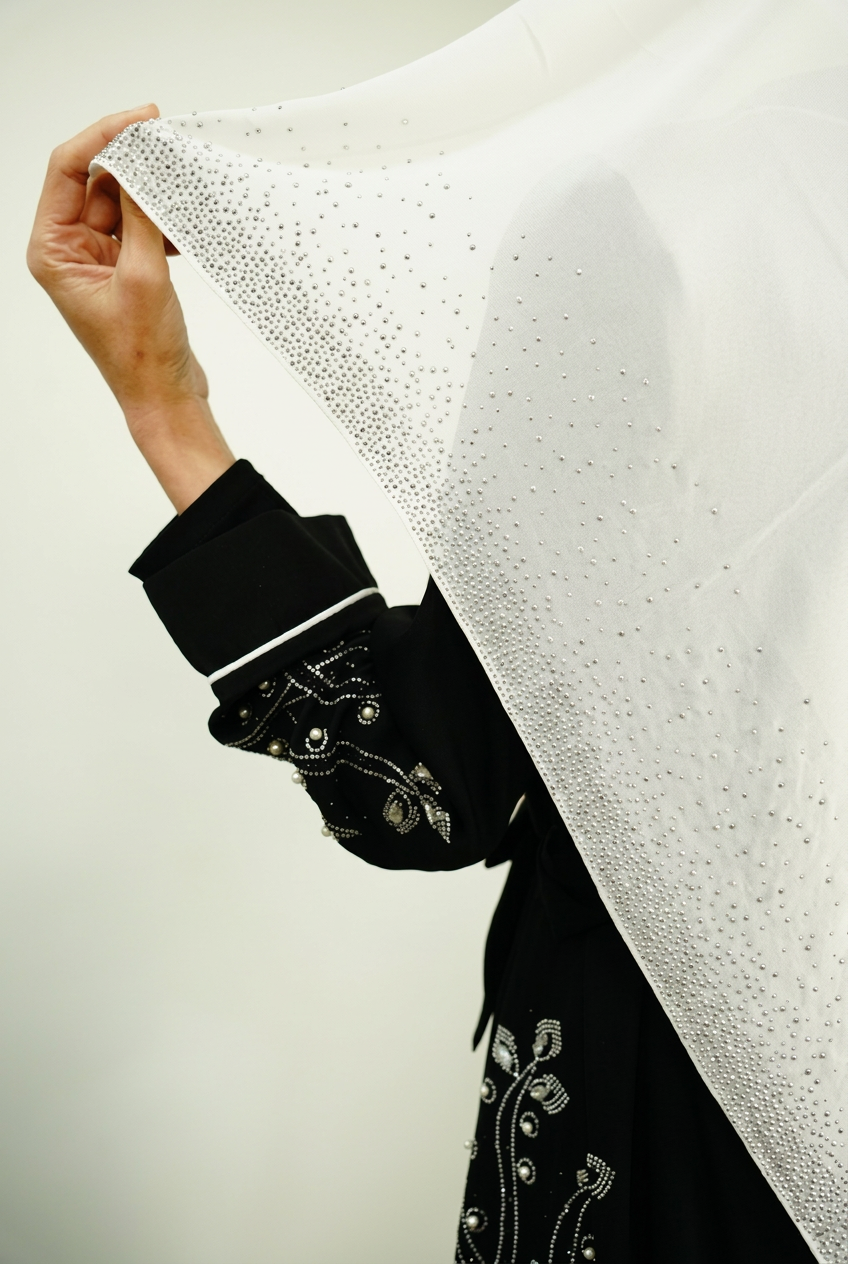 Scarf and sleeve embellishment detail